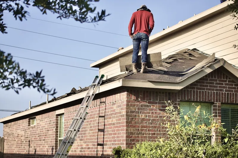 Professional roofer working on a residential roof in Sausalito